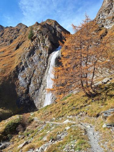 a waterfall on the side of a mountain at Ferienwohnung Mader in Kolsass