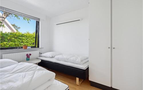 Ein Bett oder Betten in einem Zimmer der Unterkunft 3 Bedroom Cozy Home In Risskov