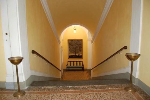 a stairway with a bench in a building at Palazzo Tucci Residenza d'epoca in Lucca