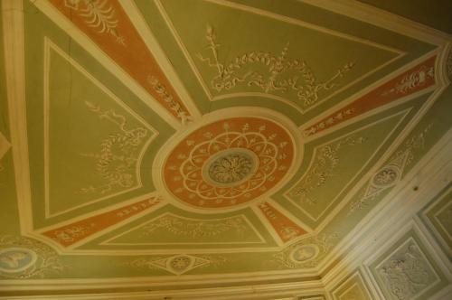 a coffered ceiling in a building with painted ceilings at Palazzo Tucci Residenza d'epoca in Lucca