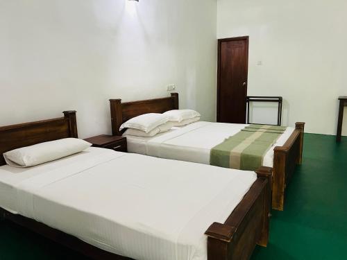 Postel nebo postele na pokoji v ubytování Kingfisher Resort & Retreat Sigiriya
