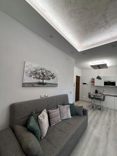 a living room with a couch and a table at B&B Stella in Somma Lombardo