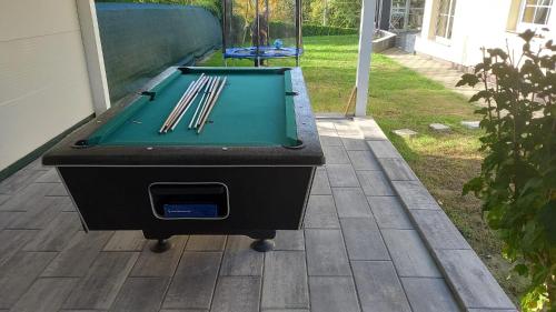 a ping pong table sitting on a patio at Aurelia in Ðurđekovec