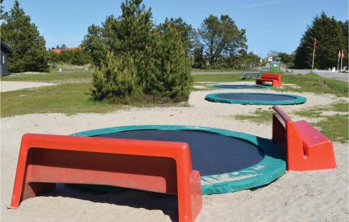 a group of trays in the sand in a park at 4 Bedroom Stunning Home In Strandby in Strandby
