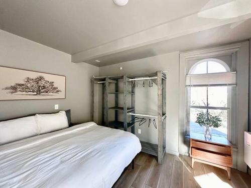 a bedroom with a large bed and a window at King Bed Suite-Free Parking-Prime Location in Detroit