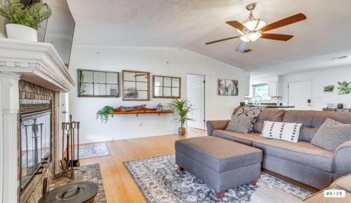 a living room with a couch and a ceiling fan at Milton Waterfront Home with Dock & Outdoor Kitchen in Milton