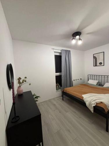 Postel nebo postele na pokoji v ubytování Apartament 8