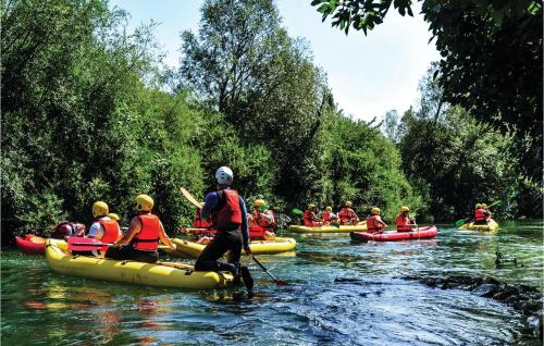 a group of people are rafting on a river at Pet Friendly Home In Omis With Sauna in Omiš