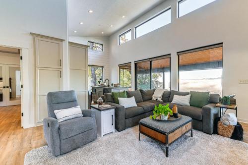 a living room with a couch and two chairs at Dreamy Hilltop View Roseburg Wine Country Retreat in Roseburg