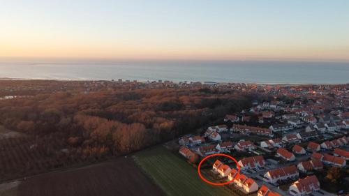 an aerial view of a city with a red circle at Villa 800 in Wissant