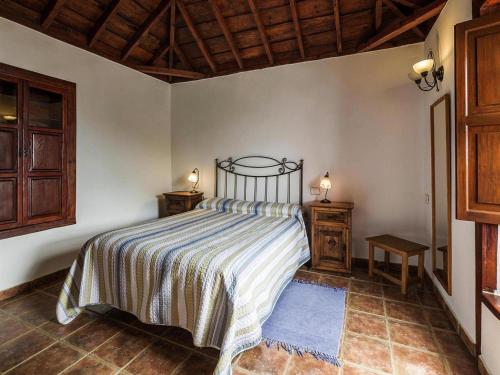 Posteľ alebo postele v izbe v ubytovaní holiday home, Puntallana