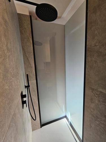 a shower with a glass door in a bathroom at Cervino 1865 family house & friends - CIR 0517 in Breuil-Cervinia
