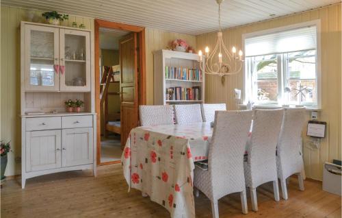 a dining room with a table and chairs at Holiday Home Sunds 35 in Sunds