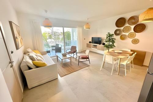 a living room with a couch and a table at Estrella Dominicus Advantage in Bayahibe