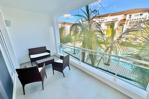 a balcony with a piano and a table and chairs at Estrella Dominicus Advantage in Bayahibe