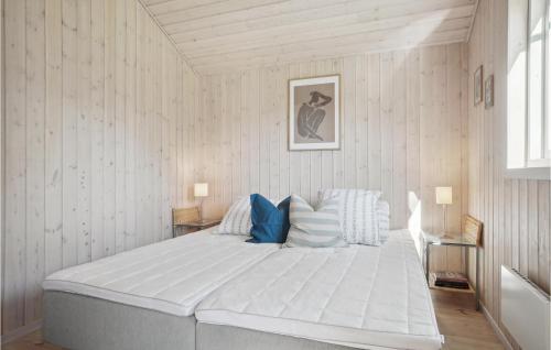 a bedroom with a large white bed in a room at Amazing Home In Vestervig With Kitchen in Vestervig