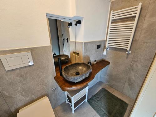 a bathroom with a sink in the middle of it at Cervino 1865 family house & friends - CIR 0517 in Breuil-Cervinia