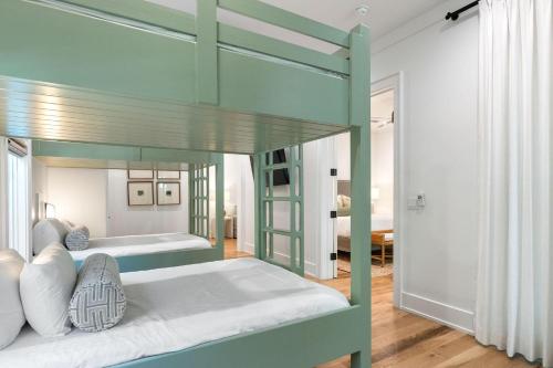 a bedroom with two bunk beds in a room at Shore To Have Fun in Seagrove Beach