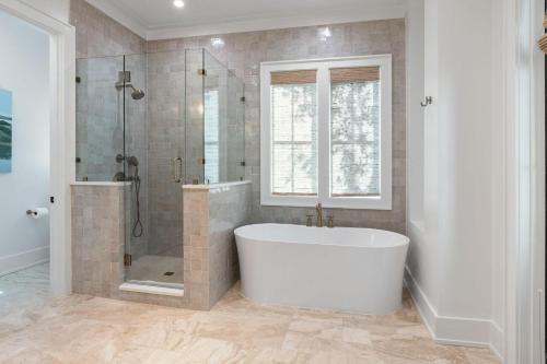a large bathroom with a tub and a shower at Shore To Have Fun in Seagrove Beach