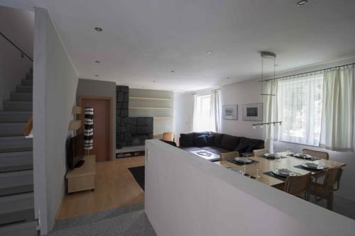 a living room with a couch and a table at Appartements Christophorus in Bad Hofgastein