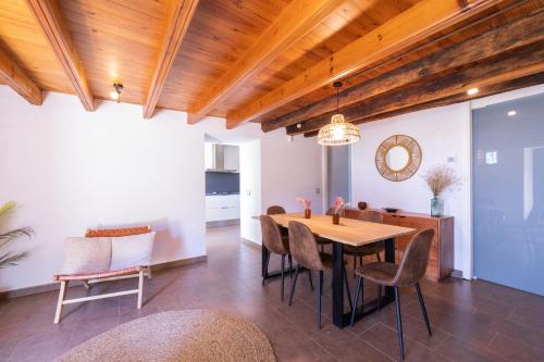 a dining room with a table and chairs at Mas El Casot 1 in Vilademuls