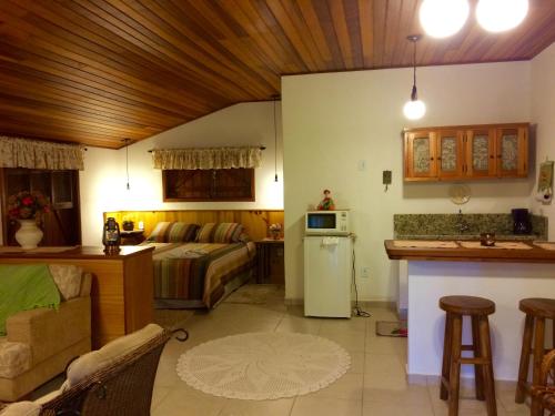 A cozinha ou cozinha compacta de Chalé Aconchegante