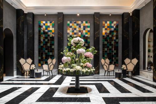 a lobby with a large display of flowers in a room at Fairmont Tazi Palace Tangier in Tangier