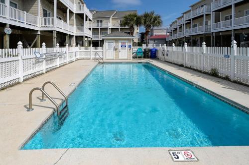 a swimming pool at a apartment complex at Ocean View Condo - Pool - Side Ocean View Decks on Each Floor in Surf City