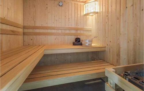 a wooden sauna with a bench in it at Lovely Home In Oosterwolde With Wifi in Oosterwolde