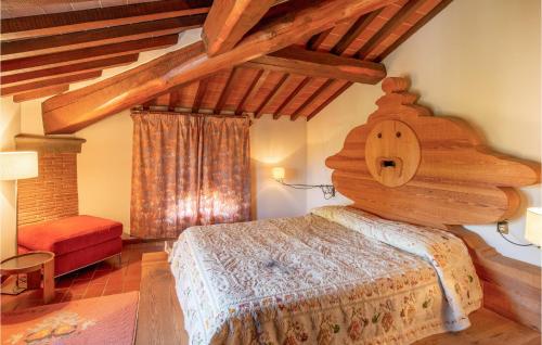 a bedroom with a large wooden bed in a room at Awesome Home In Fucecchio in Fucecchio