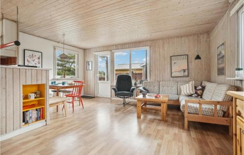 a living room with a couch and a table at Holiday Home Mølgårdsvej Thisted in Sønder Vorupør