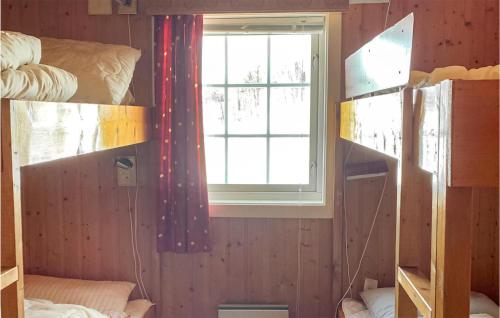 a dorm room with a window and bunk beds at 3 Bedroom Lovely Home In Hemsedal in Hemsedal