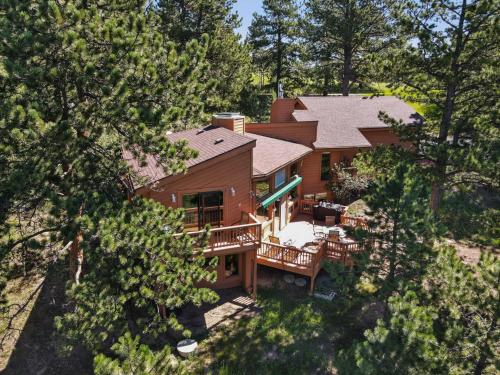 an aerial view of a house with a deck at Multiple Decks, Solarium Sitting Room, Dog Friendly, Office Space in Woodland Park