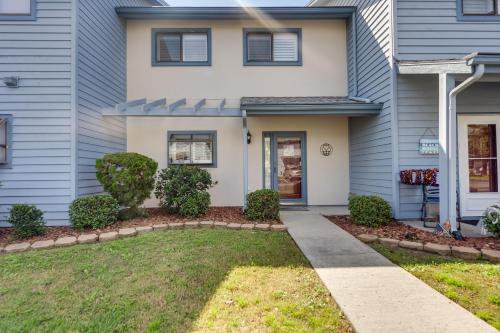 a home with a blue house at Golf Getaway with Pool Access Little River Home! in Little River