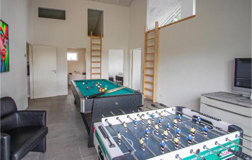 a living room with a pool table in a room at Amazing Home In Grenaa With Wifi in Grenå