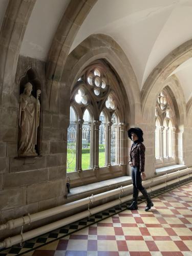 a woman is standing in a room in a building at The Classrooms, Loch Ness Abbey - 142m2 Lifestyle & Heritage apartment - Pool & Spa - The Highland Club - Resort on lake shores in Fort Augustus