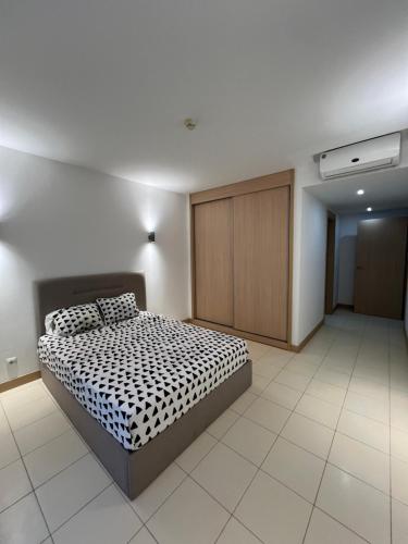 เตียงในห้องที่ Soares Appart's