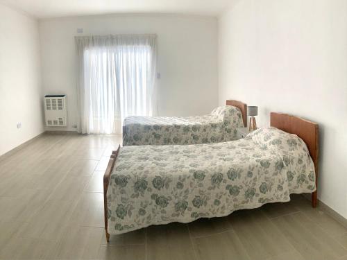 Ένα ή περισσότερα κρεβάτια σε δωμάτιο στο La Pampeanita