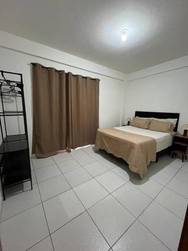 Katil atau katil-katil dalam bilik di Ap centro cascatinha prox cachoeiras