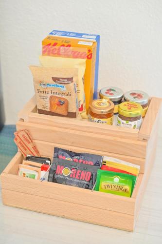 two wooden boxes filled with different types of food at Chiaia Di Rose Rooms & Apartment in Ischia