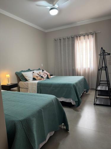 Postel nebo postele na pokoji v ubytování Casa com piscina em Foz do Iguaçu-PR
