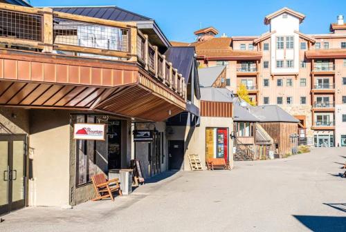 an empty street in a town with buildings at Perfect Location Outdoor Pool and Hot Tub 273 in Crested Butte