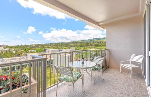 a balcony with a table and chairs and a view at The Whaler By Maui Resort Rentals in Lahaina