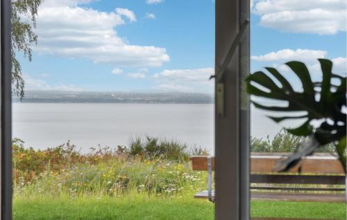 a view of a lake from a window at 3 Bedroom Gorgeous Home In Knebel in Knebel