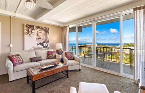 a living room with a couch and a table at The Whaler By Maui Resort Rentals in Lahaina