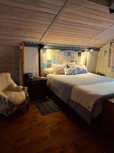 Ένα ή περισσότερα κρεβάτια σε δωμάτιο στο Casa Celeiro Flores no Pampa-RS