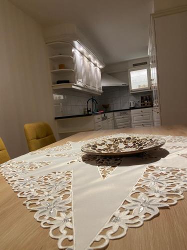 a kitchen with a table with a plate on it at Im grünen aber in 20min in Basel in Ettingen