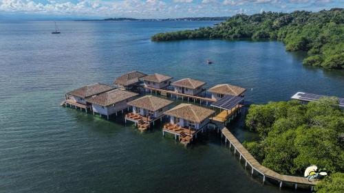 an aerial view of a resort in the water at CoralBay Bungalows Solarte in Solarte