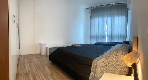 a small bedroom with a bed and a window at La Rosa dei Venti in Foligno