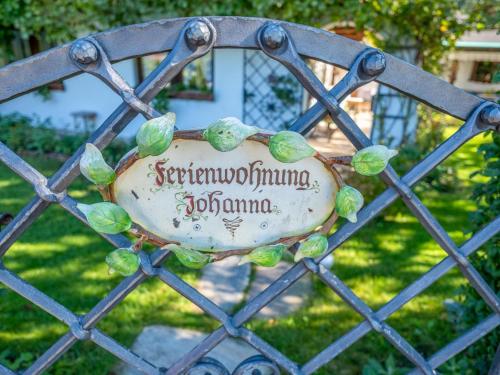 a metal gate with a sign on it at Johanna und Sonja in Scheffach